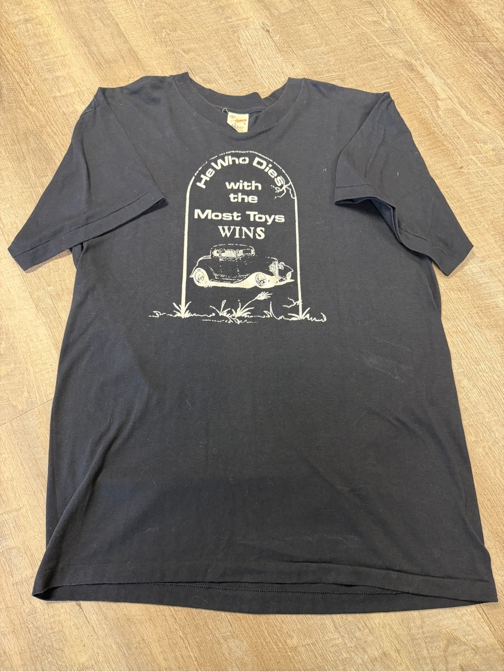 Black Graphic Tee - He Who Dies With The Most Toys Wins Single Stitch